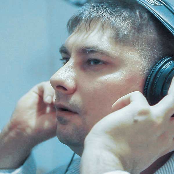 Audio engineer Damir working in the studio